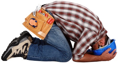 Tradesman with his head in his hands Tradesman with his head in his hands